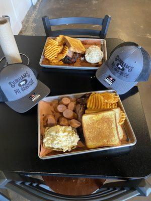 Brisket and smoked sausage with waffle fries, potato salad and coleslaw. Everything was great.