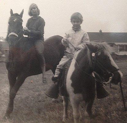 Riding the neighbor's Shetland pony, Patches, at 4-years old with my older sister.