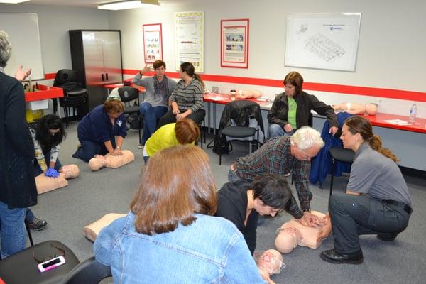 AH+RT Instructor Taneka teaching Adult/Infant CPR, AED & First Aid to the teachers of  Archbishop Howard.