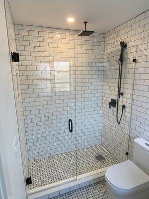 3/8"frameless shower door and panel with matte black hardware