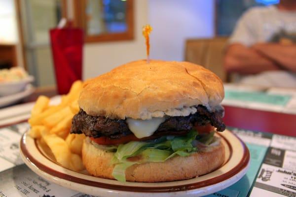 The Tiny's Burger poses for its close-up, good with one of their selections of draft beer.