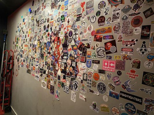 Wall of stickers by the restrooms