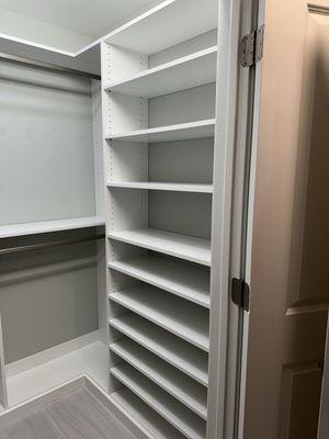 Walk in closet with shoe shelves