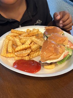 Burger with fries, I cut it up so my son could grab it better