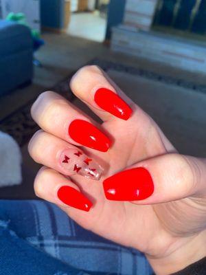 Red nails with accent butterfly