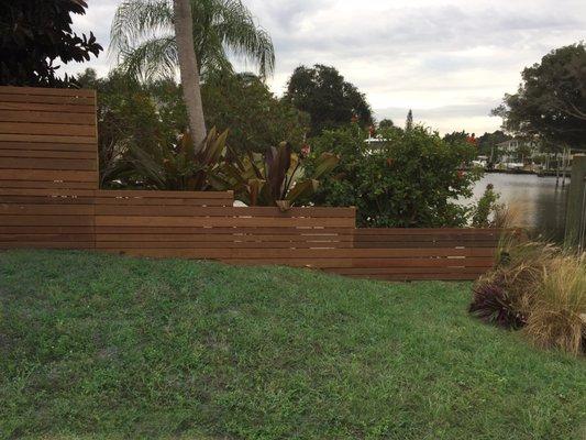 Stacked Horizontal Ipe Fence. Ipe wood is very dense and lasts much longer than any other wood fence on the market.