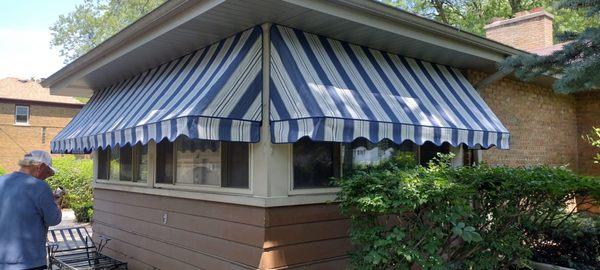 Fabric awning, rod & pocket, not taught.