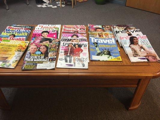 Table filled with magazines to keep you occupied