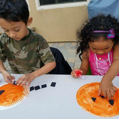 Aubry Academy students engaged and focused making their paper plate pumpkins