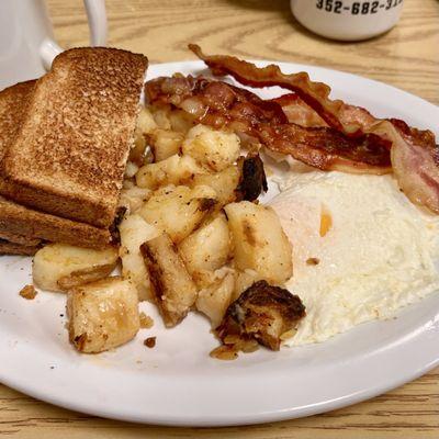 Sunrise Sampler with 2 eggs, bacon, home fries & toast