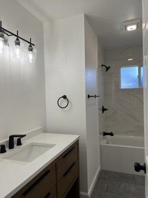 This Bath, was total remodeled, Paint was done, New tile, tile floor, features.