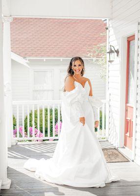 Bride smiling on bright Southern porch in Houston Texas