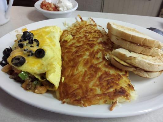 Taco omlette.  Hashbrowns and sourdough toast.  Came with a side of salsa and sour cream.