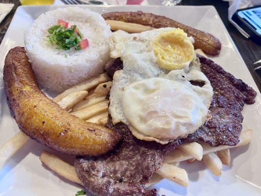 Steak 'A lo Probre'. Delicious and plenty of carbs to fill you for the entire day.