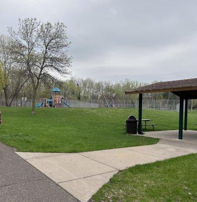 Picnic shelter and playground in the background