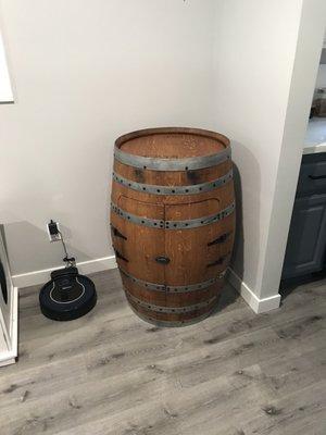 Recycled wine barrel liquor cabinet