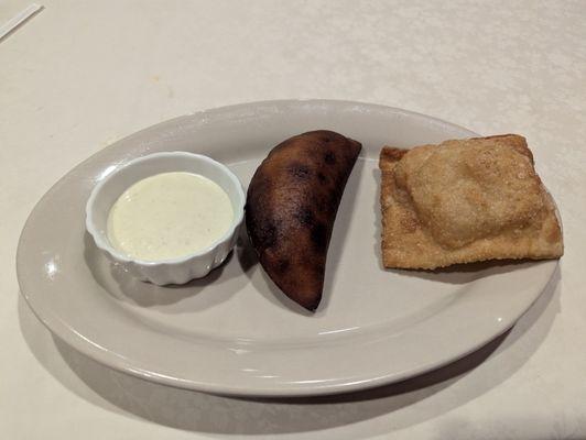 One empanada (looks burned but it was not)  and a Pastie