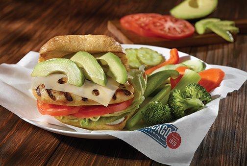 California Chicken Sandwich...Grilled chicken breast topped with Swiss cheese and avocado, served atop lettuce, tomato and a dab of signatur