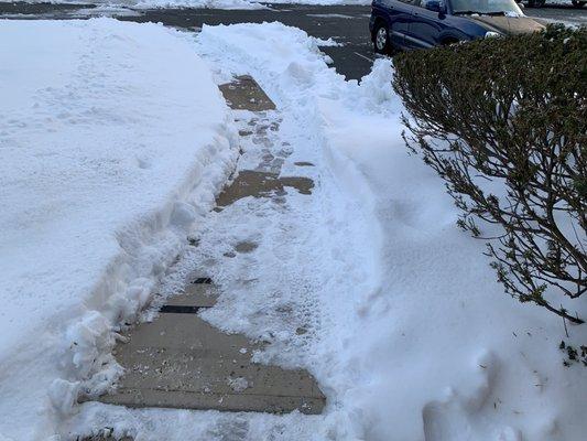 Walkway not cleared properly.