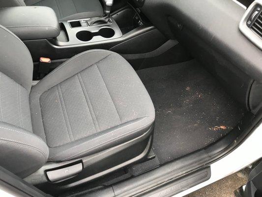 this was the condition of car on return. note some leaves, debris on floor mat, some dog hairs on seat