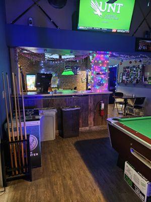 The pool tables area in the back of the restaurant.