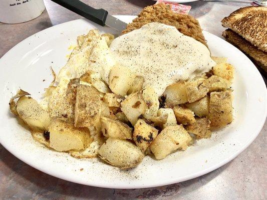 Chicken fried steak & eggs with American fries and cinnamon toast.