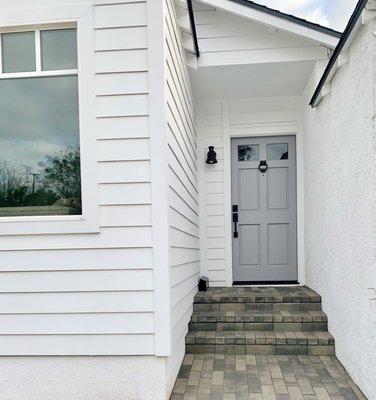 New addition exterior (left & entry): Sidings, new window, entry door, paver walkway