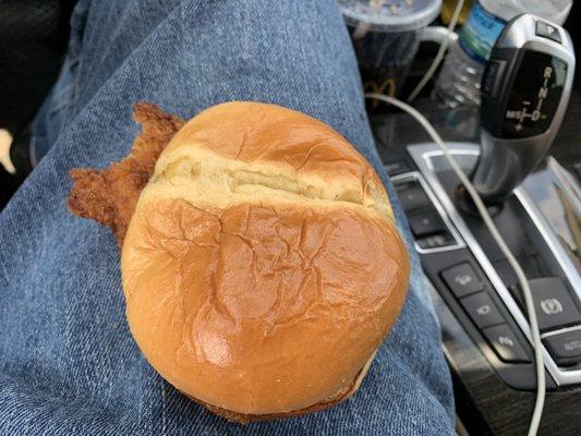 Nice crispy fried chicken piece poking it's nose out the bun after took my first bite