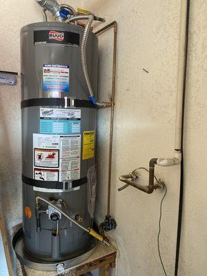 Water heater, emergency drip pan, and connectors.