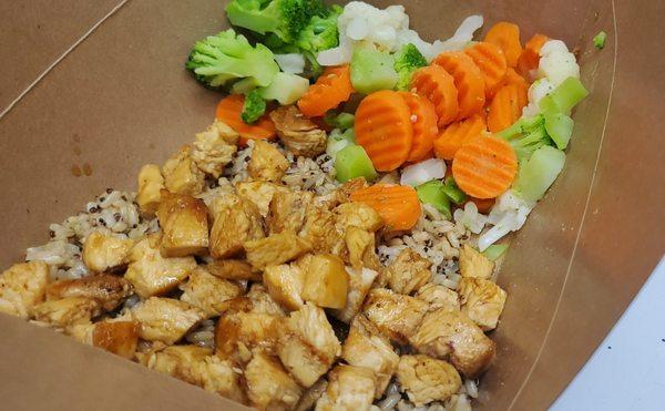 Orange chicken bowl - garlic quinoa rice, mixed veggies, diced chicken breast, and from scratch Orange sauce.