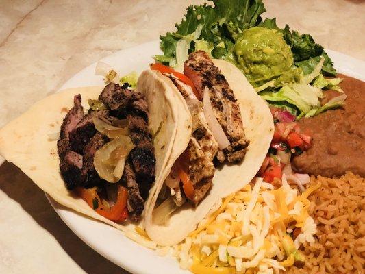 Get our Carbon Tacos as a combo! Hand rolled flour tortillas stuffed with fajita beef and chicken, grilled onions, and green chiles.