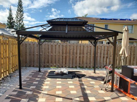 Gazebo/Pergola Assembly and Anchored to the Ground.