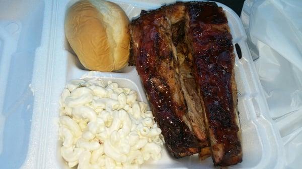 Combo 3 piece ribs meal. Macaroni salad, ribs, dinner roll and mojos that you can't reallt see because it was  hidden beneath the ribs.