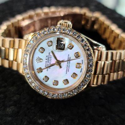 Rolex ladies 18kt Gold Watch with Diamond Bezel and Mother of Pearl Diamond Dial