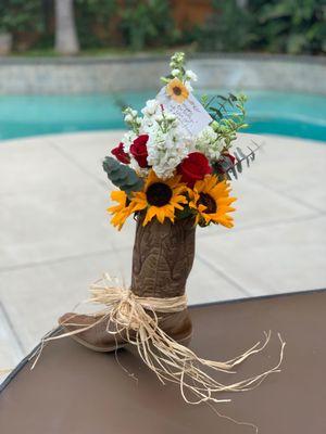 Cute boot floral arrangement! Such a great idea and gift!