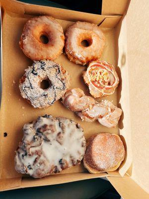 5 regular donuts, 1 blueberry fritter & 1 lemon cream filled donut!