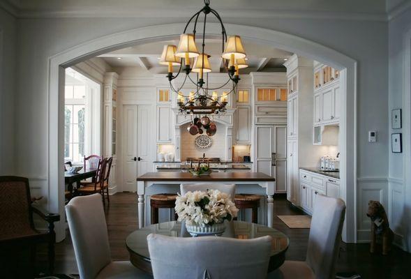 Large traditional kitchen with two large islands and paneled appliances