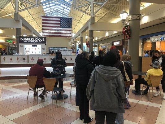 People lining up to buy bubble tea in Mayfair Mall.