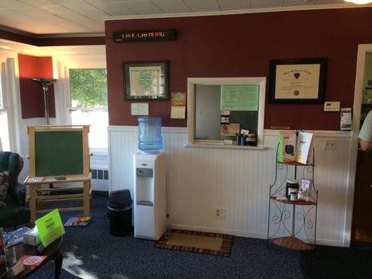 Waiting room from different angle, water dispenser, Creative chalkboard