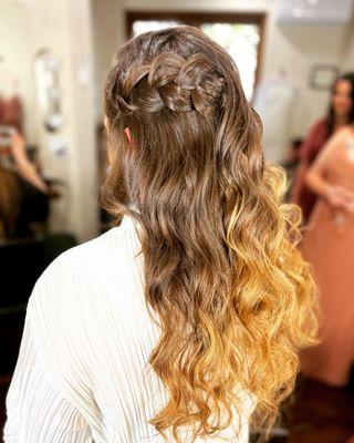 This bride opted for a boho braid on one side.  Not an updo not half up/half down but the best of both worlds