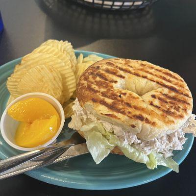 Chicken salad on bagel with chips