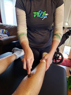 PT2EXCEL using Graston Technique to break up adhesions in this athlete's tight calf.