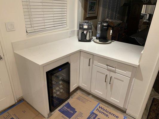 White shaker with TS 504 quartz and farmhouse sink , waterfall (quartz coming down side of cabinet w/ 45)