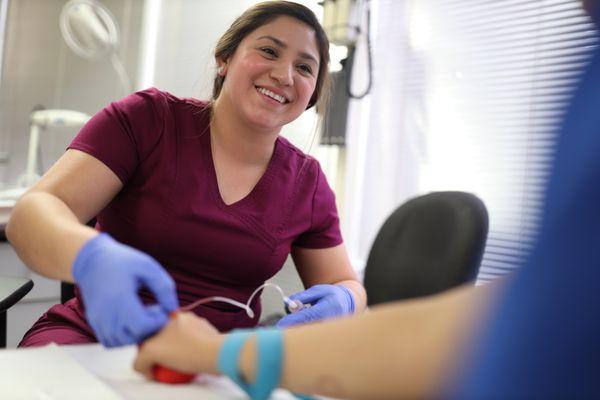 Medical Assistant student learning how to draw blood.