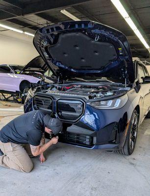 Matt working carefully to touch up the PPF.