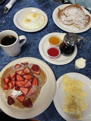 Fresh Strawberry Pancakes (In Season), Coconut Pancakes, Scrambled Eggs, Over Medium Eggs, & Coffee