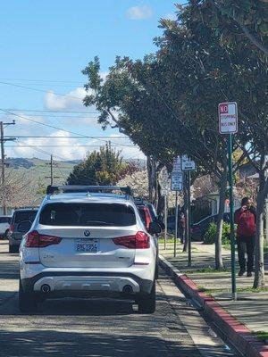 Another Dumb Parent parking in a Bus Only Zone with a red painted curb