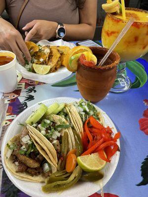 Tripas tacos (extra crispy), chicharron tacos, self serve condiments