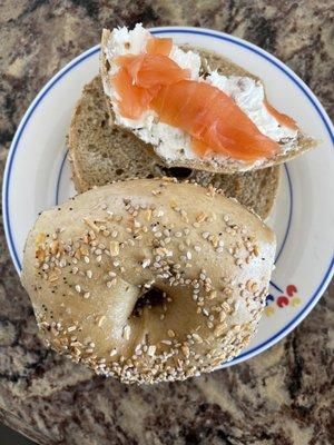 Bacon scallion cream cheese with fresh nova on a whole wheat everything bagel.