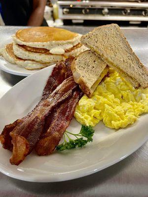 Simple eggs, bacon and toast. Added a full stack.